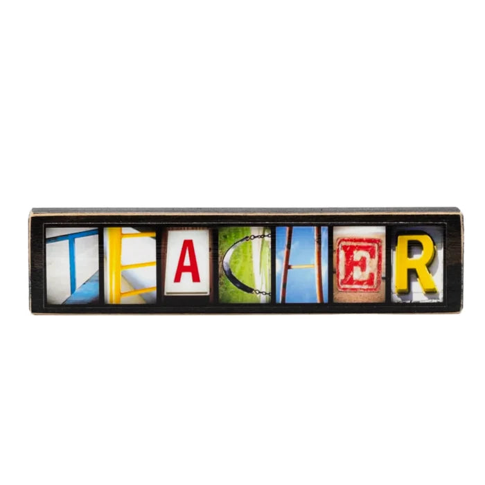 Decorative sign with colorful letters spelling 'TEACHER' on a white background