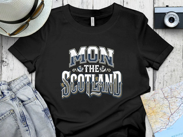 Black t-shirt with "MON SCOTLAND" text and Scottish tartan accents.