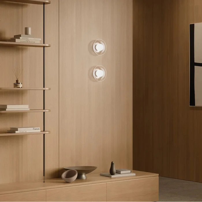 Pair of Orb Artisan Wall Lights installed in contemporary living room interior