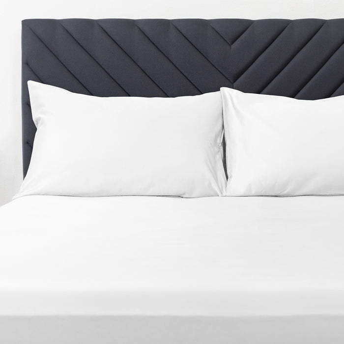 Premium Touch Bed Linens 2 Piece Pillowcase Set in white, shown in a room setting