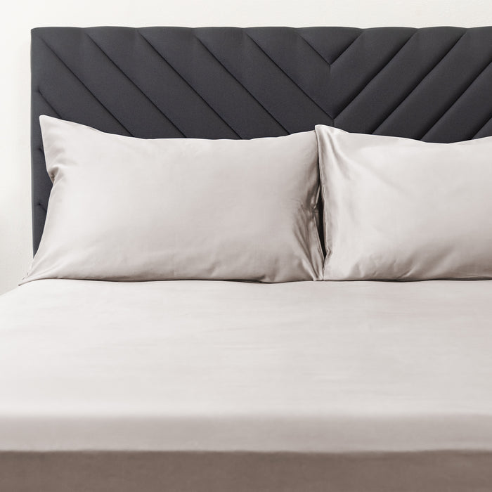 Premium Touch Bed Linens 2 Piece Pillowcase Set in gray, shown in a room setting
