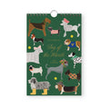 Rifle Paper Co. 2027 Dog of the Month calendar featuring colorful illustrated dog breeds on green background