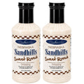 Two bottles of Nebraska Sandhills Sweet Ranch dressing on a white background