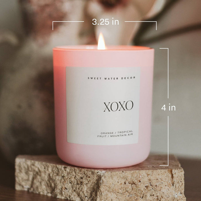 Pink XOXO soy candle with dimensions 3.25 in width and 4 in height by Sweet Water Decor