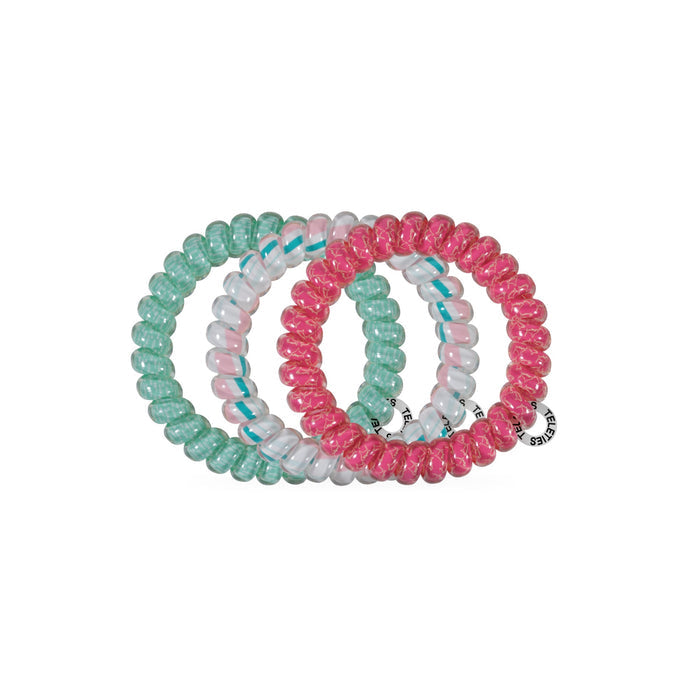 Six colorful spiral hair ties in mint, pink, white, and hot pink displayed on black background