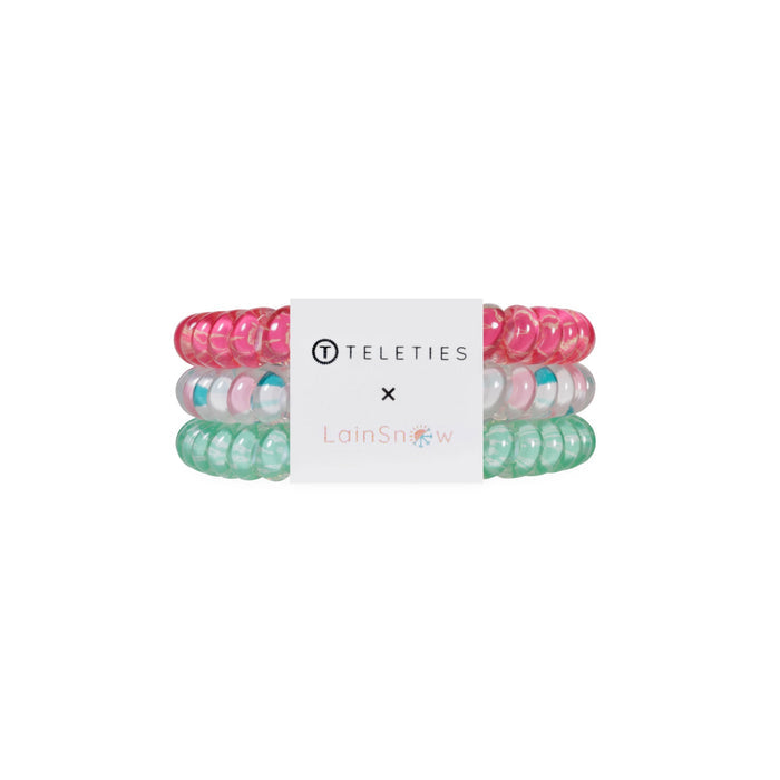 TELETIES x LainSnow small hair ties in pink, white, and green colors displayed together