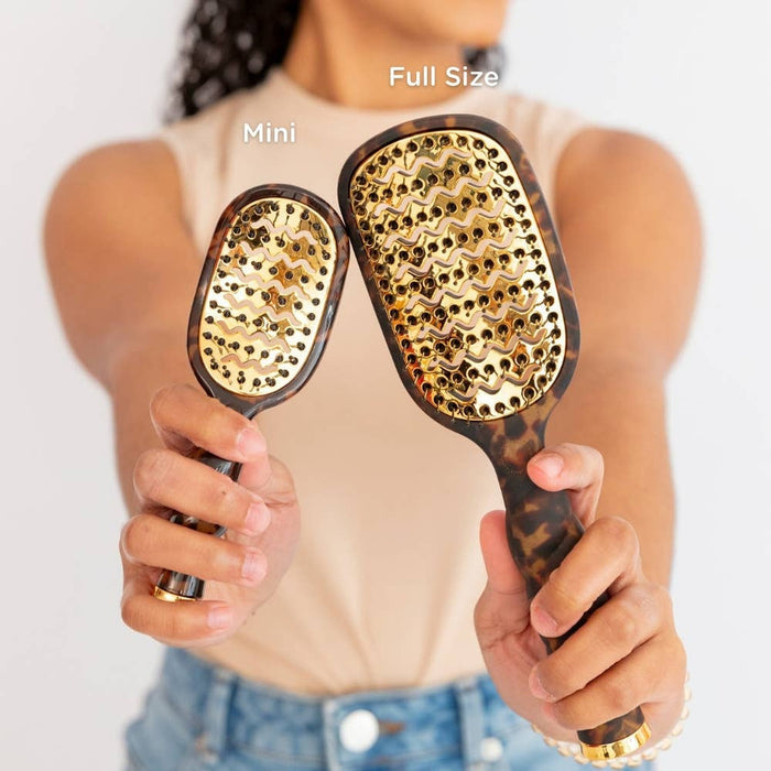 TELETIES Mini and Full Size Vented Brush comparison in tortoise pattern held by model