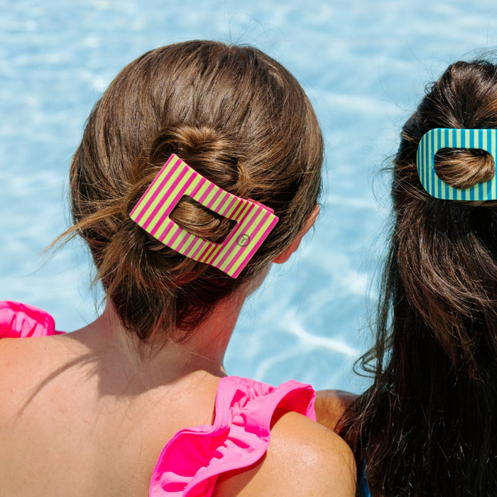 TELETIES Summer Crush hair clip worn in updo by girl at pool in striped pink and yellow design