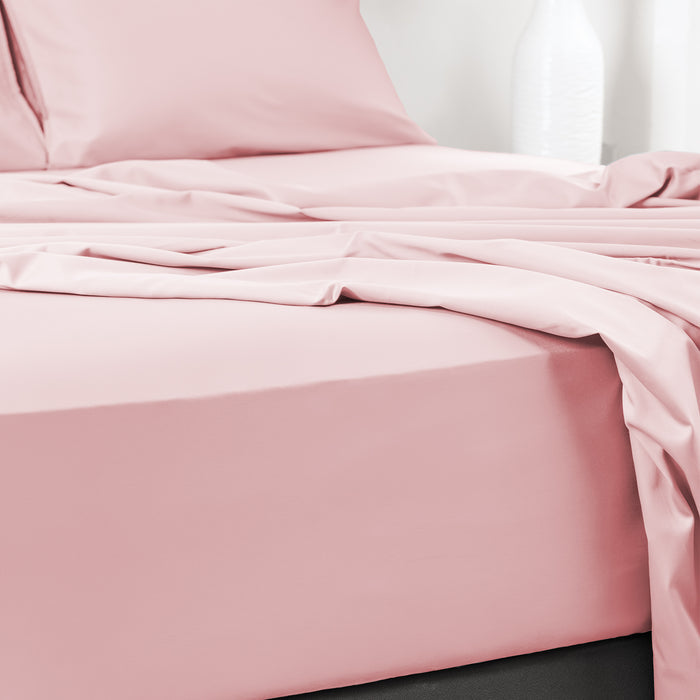 Wink Bed Linens 4 Piece Flat Sheet Set in pink, shown in a room setting